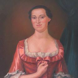 A woman in a pink 18th-century dress with lace trim stands in front of a dark background with a green curtain.