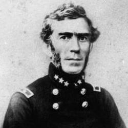 Black and white portrait of a man in a military uniform with decorative buttons and star insignia.